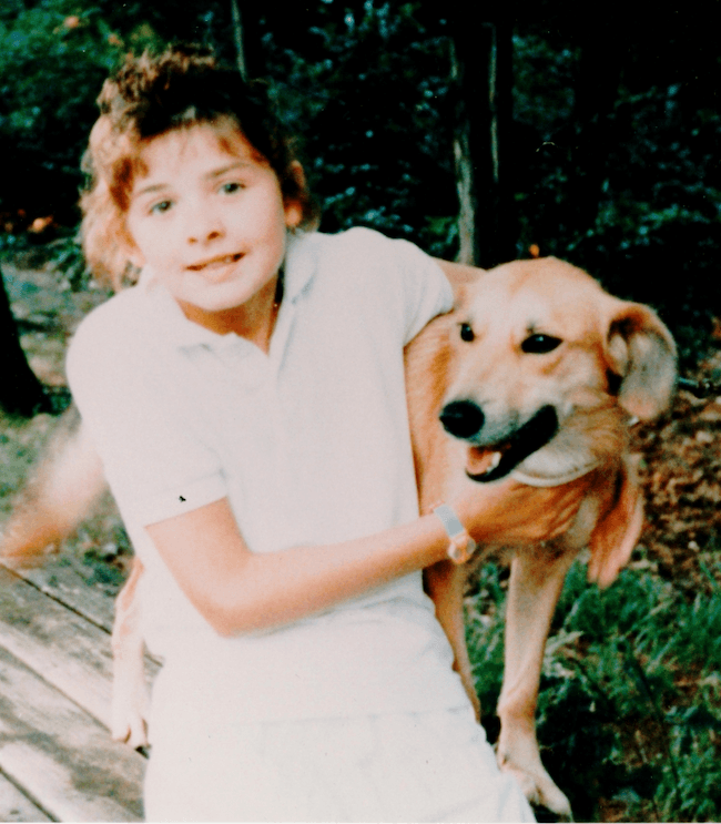 A young girl with her dog