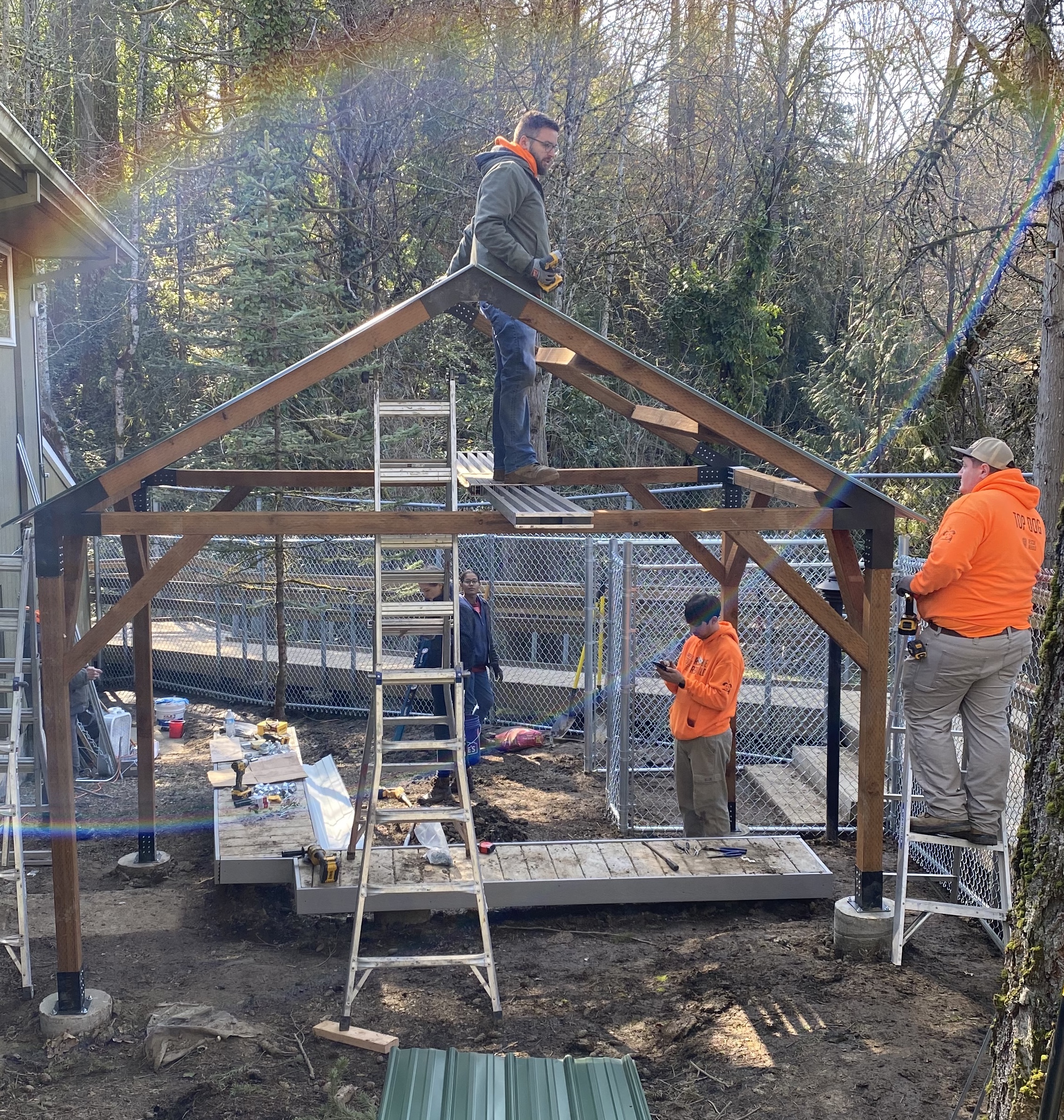 Rescue Rebuild crew work on constructing a pergola