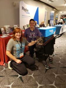 two women tabling at the National Organization for Victim Advocacy conference