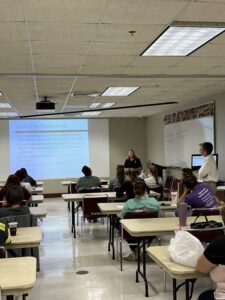 Representatives from BISSELL, Operation Catnip, and RedRover present to a room on Community Cats