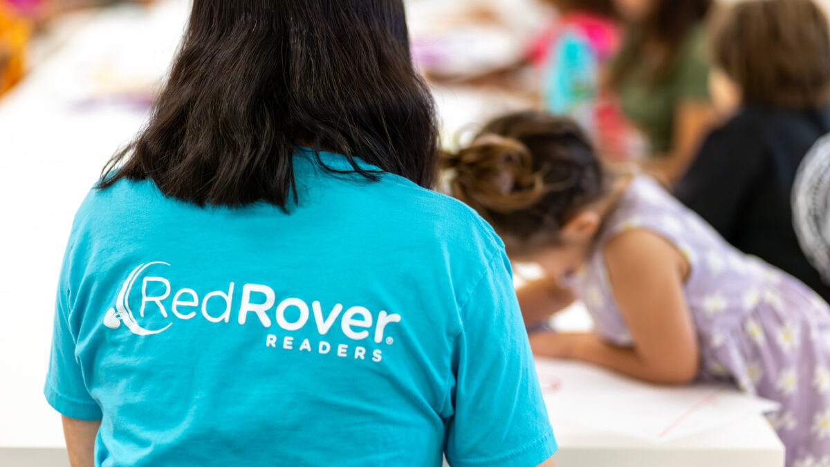 RedRover Readers representative oversees an art activity with children