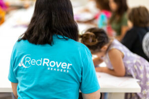 RedRover Readers representative oversees an art activity with children