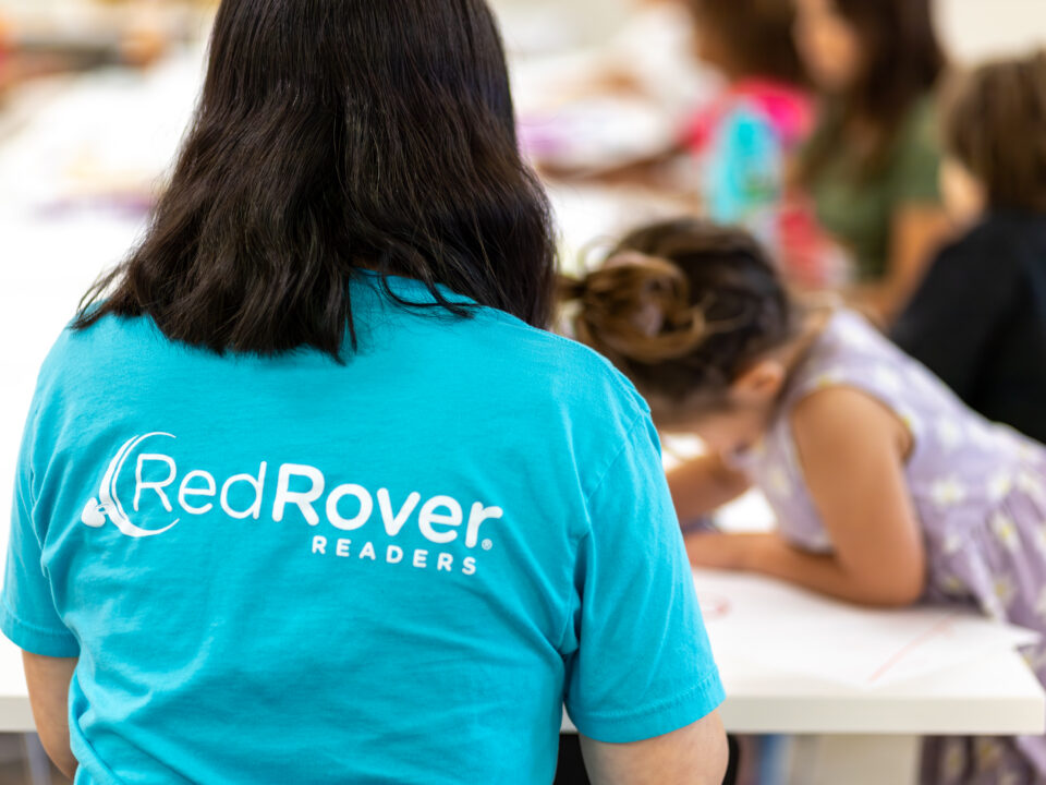 RedRover Readers representative oversees an art activity with children