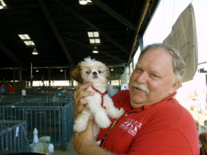 RedRover Responders volunteer holds a dog at Hurricane Katrina