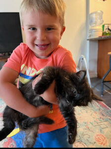 On-Call Angel Cynthia's great-grandson holding a cat