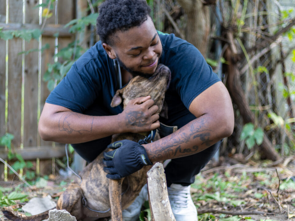 RedRover Responders deployment - Detroit Dog Aide - pet parent hugs his dog