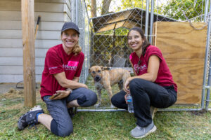 RedRover Responders deployment - Detroit Dog Aide - volunteers pose with family dog