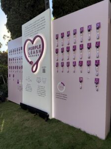 Purina and RedRover's wall of Purple Leash Project pet collars, featured at Hollywood's Variety Power of Women event