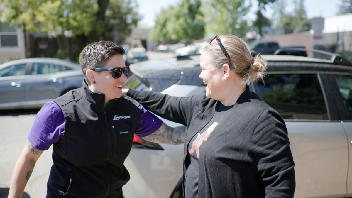RedRover President and CEO Katie Campbell shakes hands with Director of the Living Room Center in Santa Rosa
