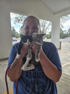 RedRover Responders Deployment with PAWS of NE LA - veterinarian holds two kittens