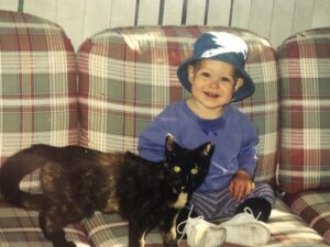 RedRover Membership and Administrative Assistant, Claire, with her childhood cats