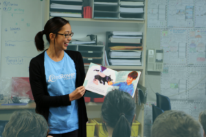 RedRover Readers volunteer Claire reads to children