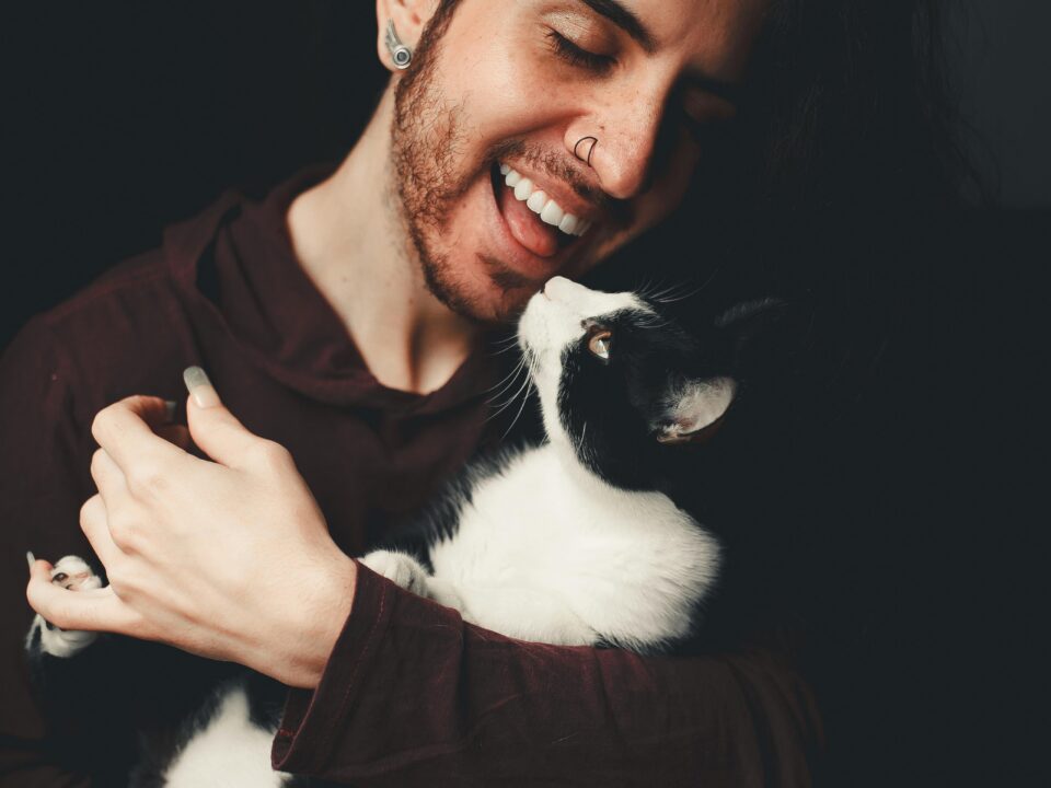 Nonbinary person holding a cat