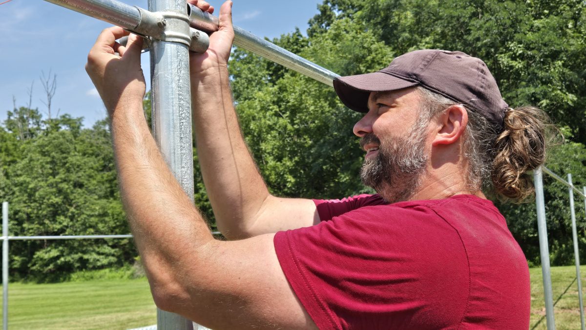 RedRover Responders volunteer installs fencing