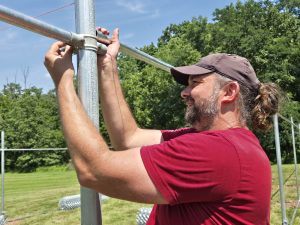 RedRover Responders volunteer installs fencing