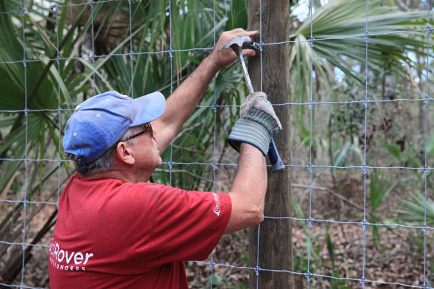 RedRover Responders volunteer Craig builds fencing.